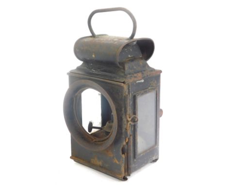 A Victorian tin railway lamp, lacking frontal glass, 25cm high. 