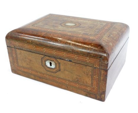 A Victorian walnut sewing box, with a domed top, inlaid with mother of pearl and boxwood strung, with a purple cushioned inte