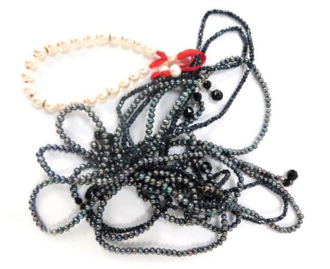 Two items of Claudia Bradbury jewellery, comprising a Claudia Bradbury Akira Tie multi strand necklace, and a Poppy Appeal cu