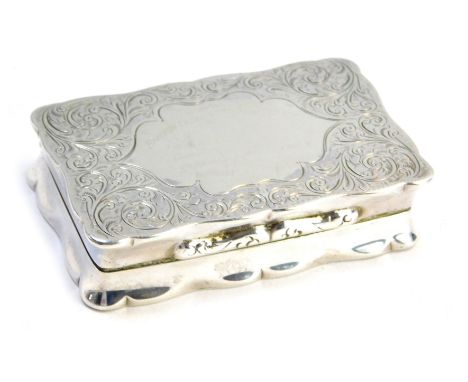 A George VI silver snuff box, of serpentine form, with foliate engraving, central vacant shield reserve, Joseph Gloster Limit