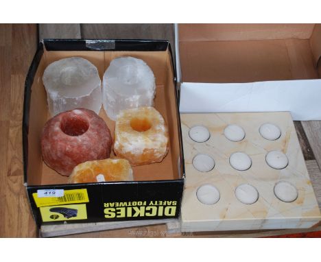 A quantity of mineral tea light holders.