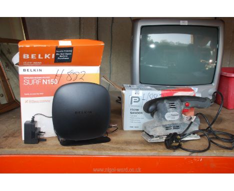 A 150v Sander and a boxed Belkin Router (both working at time of lotting).
