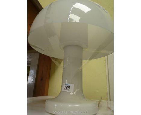 A glass lamp and shade.