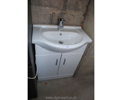 A wash basin on cabinet, 26" wide x 18" deep x 32" high.