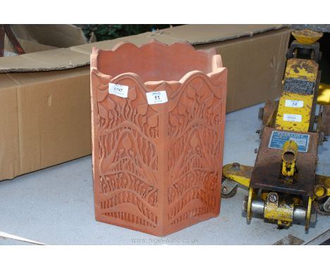 A highly decorated hexagonal terracotta planter, 12 1/2" high x 11" diameter.