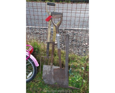 A miner's pick axe, spades and a fork.