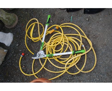 A heavy duty ratchet action aluminium lopper and a garden hose.