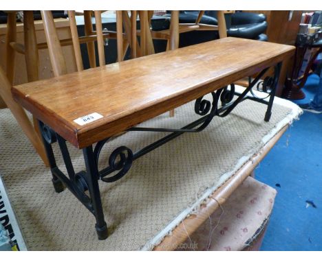 A darkwood low style stool with metal frame.