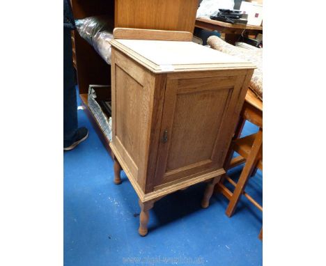 A light oak pot cupboard.