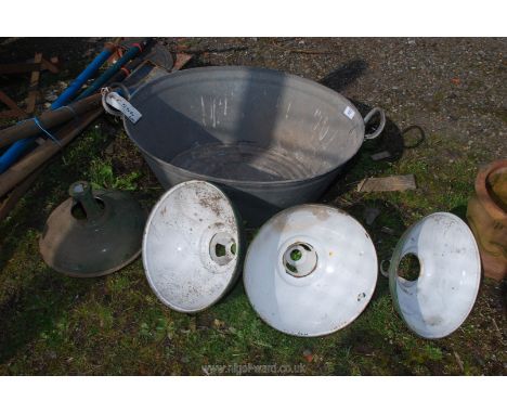 A galvanised bath 2' x 19" wide and four enamel light shades.