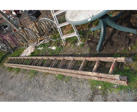 A 16 rung double wooden ladder.
