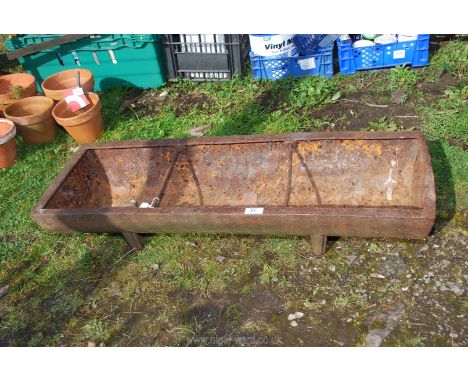 A cast iron pig trough, 35 1/2'' long x 12''.