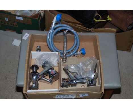 A pair of basin taps and a pair of bath taps.