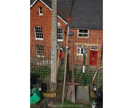 A quantity of garden tools; spades, rake, root fork, etc.