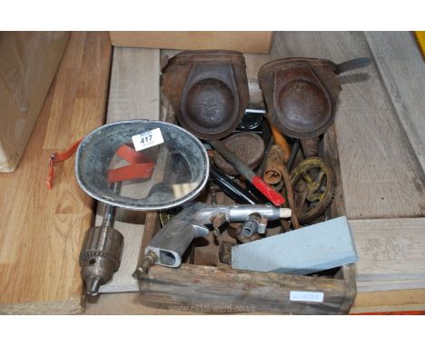 A wooden box of goggles, pneumatic blow gun, drill chuck, etc.