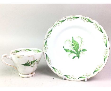 TUSCAN PART TEA SERVICE, MAYTIME PATTERN comprising saucers, plates, cups, cake plates and a cream jug