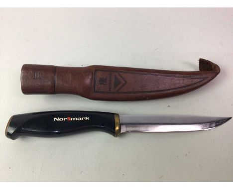 NORMARK SKINNING KNIFE, AND OTHERS  in leather scabbard, along with a group of paper knives, folding knife and Eastern dagger