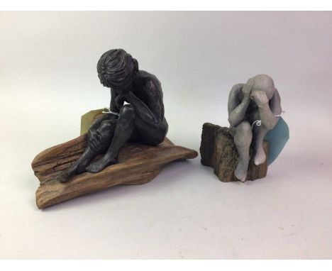 ANNE MORRISON DA, CERAMIC AND DRIFTWOOD FIGURE, DEEP IN THOUGHT modelled as a nude female crouched on a section of wood, alon