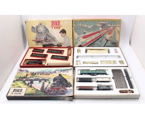 Three HO gauge vintage Piko train sets to include a monorail set, comprising a 3-car monorail, track, and supports, an SNCF C