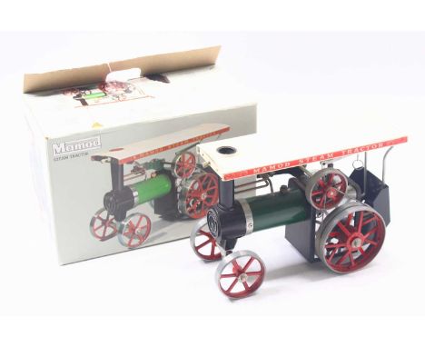 A Mamod Steam Tractor TE1A, a green body, white roof, and red wheels, the model is dusty from being on display, sold in the o