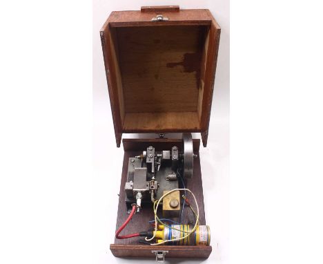 Scratch-built 2-stroke petrol combustion engine, comprising a single oscillating cylinder, a commercially made ignition syste