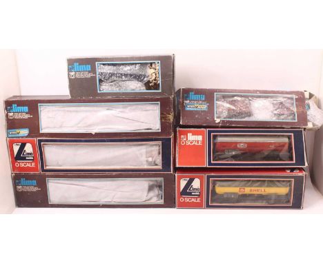 A collection of Lima 0 gauge rolling stock to include a 4F in maroon, two bogie tanker wagons, one four-wheeled van, and thre