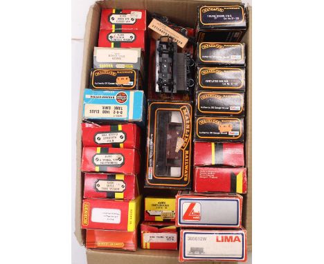 One box of approx 24x 00 gauge wagons and two 00 gauge GWR chocolate and cream coaches by Hornby. The wagons are by various m