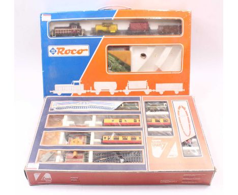 Two early 00 gauge sets, including a Lima class 25 set, comprising a BR green class 25, and two red and cream coaches, with t