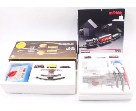 Two Marklin Mini Club Z gauge sets, including an 8165A special limited set, with a green Belgian loco, and two wagons, and a 
