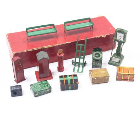 Railway Accessories No.3 box containing two seats, post box, platform ticket machine, fire box, sack barrow, stamping machine
