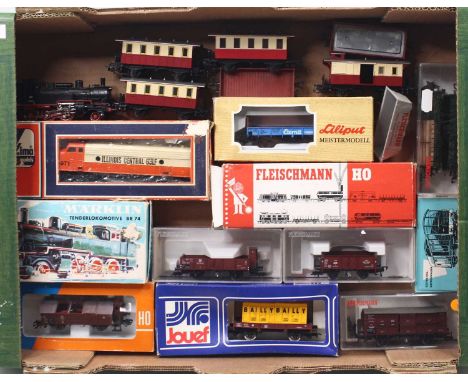 A collection of HO gauge locos and rolling stock to include a Marklin BR74 loco, in DB black, and an American BO-BO loco, tog