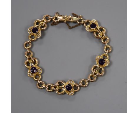An Edwardian 9ct, amethyst and seed pearl set bracelet.