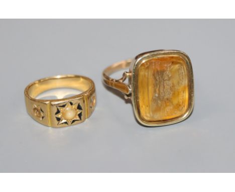 A Victorian yellow metal and enamel ring and a Victorian yellow metal and citrine intaglio ring inscribed 'Gone Away' with fo