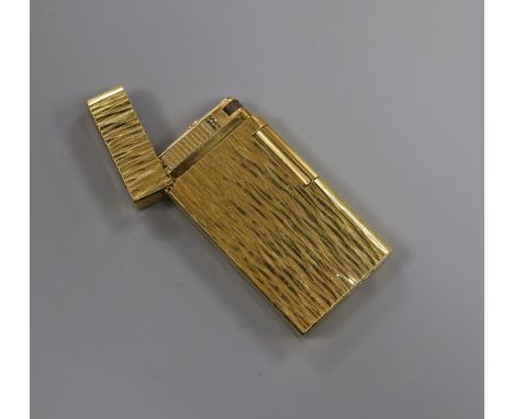 A Caran Dache gold plated lighter