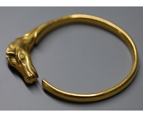 A Hermes gold plated Horse head bangle, with box.