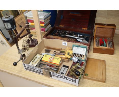 A collection of professional watch makers tools and reference books