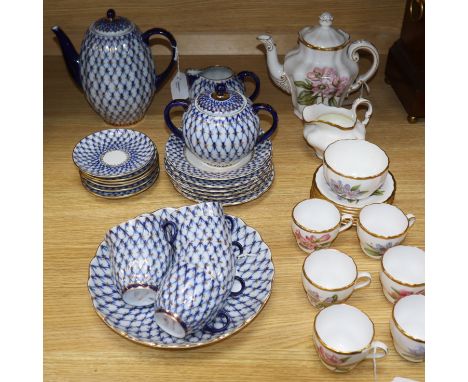 A Lomonosov 'Cobalt Net' coffee service for six and a Spode coffee service decorated with pink flowers
