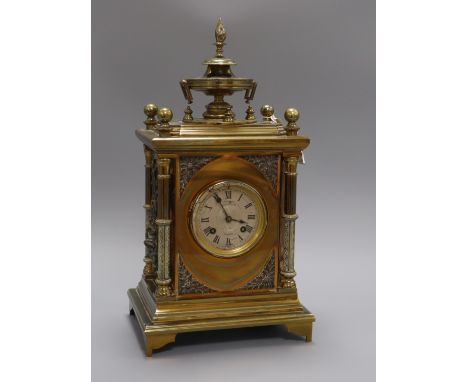 A 19th century gilt brass and silvered metal mantel clock, J W Benson, London, having white Roman dial and ornate architectur