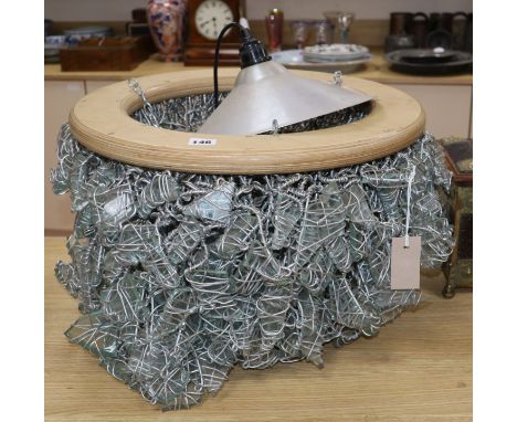 A modern design glass and wire work light fitting