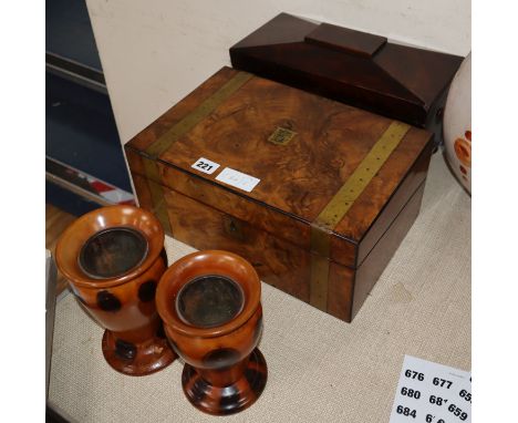 A Victorian walnut writing slope, a mahogany sarcophagus tea caddy and two turned wood vases.