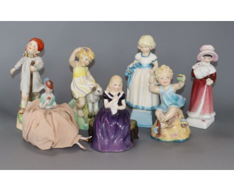 A collection of Royal Worcester figurines, two Doulton figures and a pin dolly