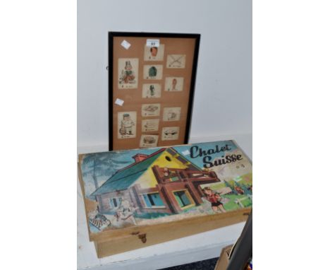 A boxed Chalet Suisse  no.3  game of building blocks; various playing cards framed and mounted 