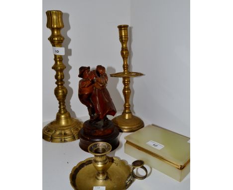 A large 20th century brass candlestick; another; an onyx cigarette box; a wooden figure group of a dancing couple ; a brass c