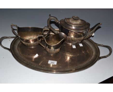 An E.P.N.S two-handled gallery tray; an E.P.N.S three piece tea service;