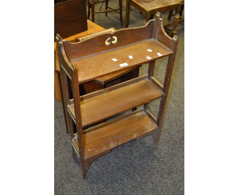 An early 20th century mahogany hexagonal occasional table ; an Arts and Crafts oak three tier shelf unit/bookcase  (2)