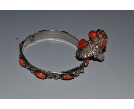 A silver and coral bracelet and ring