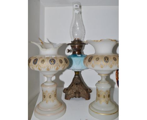 A pair of Victorian opaque glass lustres (faults) , an Art Nouveau style oil lamp , blue opaque glass reservoir