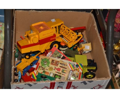 Toys - a Matchbox Super kings bridge transporter, New Holland combine harvester, hay bailing machine, Massy Ferguson tractor;