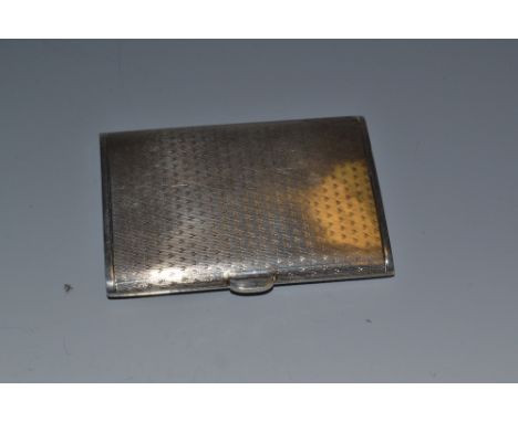 A silver card case, engine turned