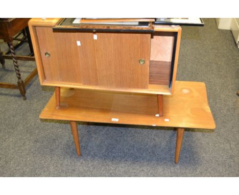 A 20th century Ercol style coffee table, the lightly shaped top over tapering legs; a similar style record cabinet with slidi